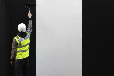 A worker paints a wall on a construction site in London January 5, 2011. REUTERS/Stefan Wermuth A worker paints a wall on a construction site in London January 5, 2011. REUTERS/Stefan Wermuth