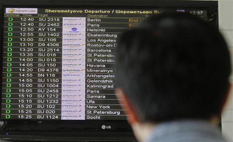 A man looks at a flight information board at Moscow's Sheremetyevo airport June 27, 2013. REUTERS/Alexander Demianchuk A man looks at a flight information board at Moscow's Sheremetyevo airport June 27, 2013. REUTERS/Alexander Demianchuk