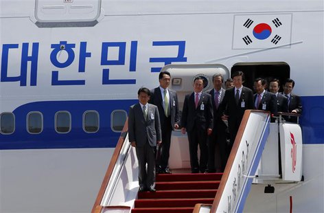 South Korean government officials and lawmakers accompanying President Park Geun-hye (unseen) arrive at the airport in Beijing June 27, 2013 South Korean government officials and lawmakers accompanying President Park Geun-hye (unseen) arrive at the airport in Beijing June 27, 2013