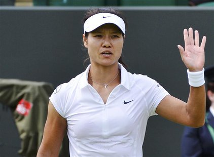 Li Na of China celebrates after defeating Simona Halep of Romania in their women's singles tennis match at the Wimbledon Tennis Championship Li Na of China celebrates after defeating Simona Halep of Romania in their women's singles tennis match at the Wimbledon Tennis Championship