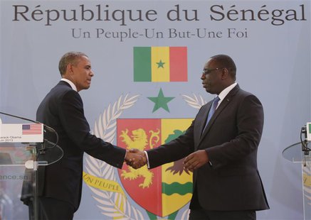 U.S. President Barack Obama (L) and Senegal President Macky Sall shake hands after their joint news conference at the Presidential Palace Ju U.S. President Barack Obama (L) and Senegal President Macky Sall shake hands after their joint news conference at the Presidential Palace Ju