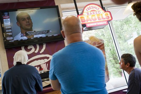 People watch a television at Dunkin Donuts as New England Patriots tight end Aaron Hernandez is arraigned next door in the Attleborough Dist People watch a television at Dunkin Donuts as New England Patriots tight end Aaron Hernandez is arraigned next door in the Attleborough Dist