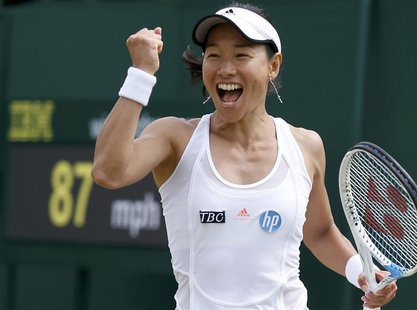 Kimiko Date-Krumm of Japan celebrates after defeating Alexandra Cadantu of Romania in their women's singles tennis match at the Wimbledon Te Kimiko Date-Krumm of Japan celebrates after defeating Alexandra Cadantu of Romania in their women's singles tennis match at the Wimbledon Te