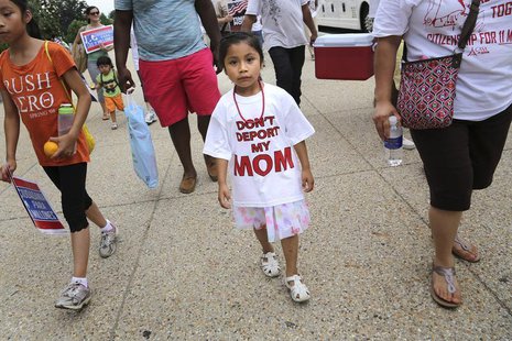 A girl wears a "Don't Deport My Mom t-shirt" as she joins immigrants and activists, led by Service Employees International Union (SEIU) and A girl wears a "Don't Deport My Mom t-shirt" as she joins immigrants and activists, led by Service Employees International Union (SEIU) and