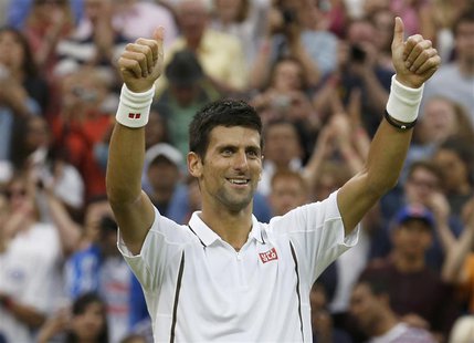 Novak Djokovic of Serbia celebrates after defeating Bobby Reynolds of the U.S. during their men's singles tennis match at the Wimbledon Tenn Novak Djokovic of Serbia celebrates after defeating Bobby Reynolds of the U.S. during their men's singles tennis match at the Wimbledon Tenn