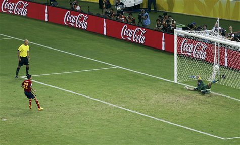 Spain's Jesus Navas scores the winning penalty against Italy's goalkeeper Gianluigi Buffon (R) during the penalty shootout of their Confeder Spain's Jesus Navas scores the winning penalty against Italy's goalkeeper Gianluigi Buffon (R) during the penalty shootout of their Confeder