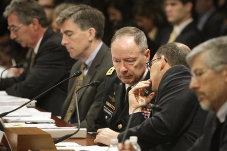 National Security Agency (NSA) Director U.S. Army General Keith Alexander (C) confers with FBI Deputy Director Sean Joyce (2nd R) as they te National Security Agency (NSA) Director U.S. Army General Keith Alexander (C) confers with FBI Deputy Director Sean Joyce (2nd R) as they te