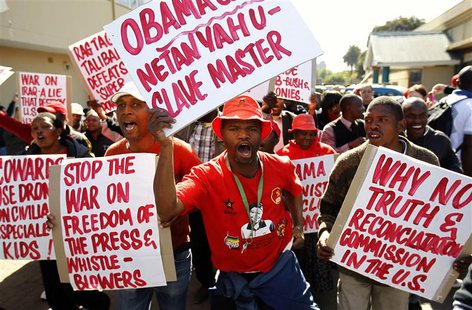 Protesters carry placards as they protest against the visit of U.S. President Barack Obama in Pretoria, June 28, 2013. REUTERS/Siphiwe Sibek Protesters carry placards as they protest against the visit of U.S. President Barack Obama in Pretoria, June 28, 2013. REUTERS/Siphiwe Sibek
