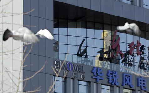 Pigeons fly past the company logo of Sinovel Wind Co., Ltd. outside its head office in Beijing, January 6, 2011. REUTERS/Soo Hoo Zheyang Pigeons fly past the company logo of Sinovel Wind Co., Ltd. outside its head office in Beijing, January 6, 2011. REUTERS/Soo Hoo Zheyang