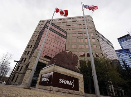 Flags fly over the Shaw Communications corporate headquarters in Calgary, Alberta May 3, 2010. REUTERS/Todd Korol Flags fly over the Shaw Communications corporate headquarters in Calgary, Alberta May 3, 2010. REUTERS/Todd Korol