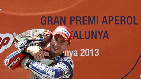 Yamaha MotoGP rider Jorge Lorenzo of Spain holds the trophy celebrating his victory on the Catalunya Grand Prix in Barcelona June 16, 2013. Yamaha MotoGP rider Jorge Lorenzo of Spain holds the trophy celebrating his victory on the Catalunya Grand Prix in Barcelona June 16, 2013.