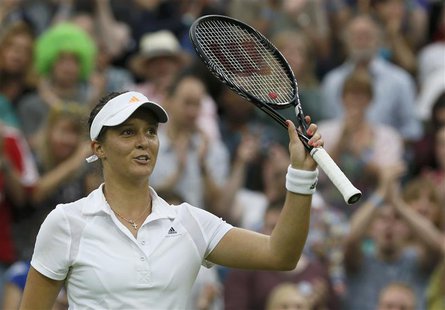 Laura Robson of Britain celebrates after defeating Mariana Duque-Marino of Colombia in their women's singles tennis match at the Wimbledon T Laura Robson of Britain celebrates after defeating Mariana Duque-Marino of Colombia in their women's singles tennis match at the Wimbledon T