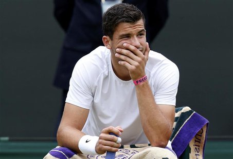 Grigor Dimitrov of Bulgaria waits as his men's singles tennis match against Grega Zemlja of Slovenia was stopped for rain on match point at Grigor Dimitrov of Bulgaria waits as his men's singles tennis match against Grega Zemlja of Slovenia was stopped for rain on match point at