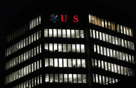 A partially illuminated logo of Swiss bank UBS is seen on a building in Zurich December 18, 2012. REUTERS/Michael Buholzer A partially illuminated logo of Swiss bank UBS is seen on a building in Zurich December 18, 2012. REUTERS/Michael Buholzer