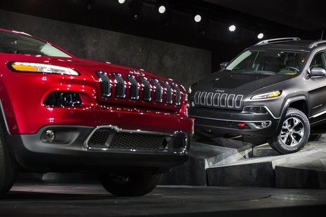 A Limited and a Trailhawk model 2014 Jeep Cherokee are seen on stage after being unveiled at the New York International Auto Show in New Yor A Limited and a Trailhawk model 2014 Jeep Cherokee are seen on stage after being unveiled at the New York International Auto Show in New Yor