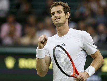 Andy Murray of Britain reacts after defeating Tommy Robredo of Spain in their men's singles tennis match at the Wimbledon Tennis Championshi Andy Murray of Britain reacts after defeating Tommy Robredo of Spain in their men's singles tennis match at the Wimbledon Tennis Championshi