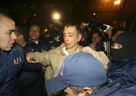 The former governor of Quintana Roo state Mario Villanueva (C) is arrested by members of Mexico's Federal Investigative Agency (AFI) moments The former governor of Quintana Roo state Mario Villanueva (C) is arrested by members of Mexico's Federal Investigative Agency (AFI) moments