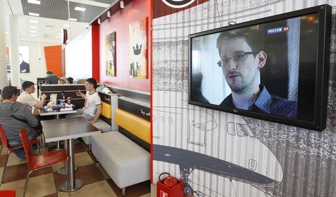 A television screen shows former U.S. spy agency contractor Edward Snowden during a news bulletin at a cafe at Moscow's Sheremetyevo airport A television screen shows former U.S. spy agency contractor Edward Snowden during a news bulletin at a cafe at Moscow's Sheremetyevo airport