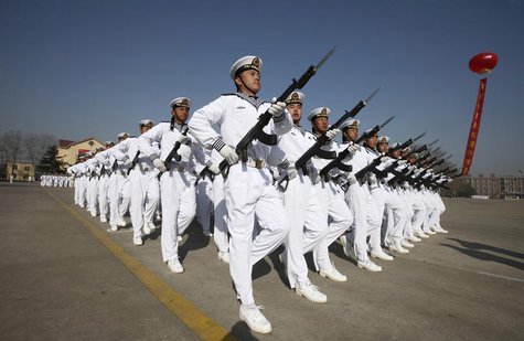 New recruits of the Chinese Navy march with their guns during the parade marking the end of their first training session in Qingdao, Shandon New recruits of the Chinese Navy march with their guns during the parade marking the end of their first training session in Qingdao, Shandon