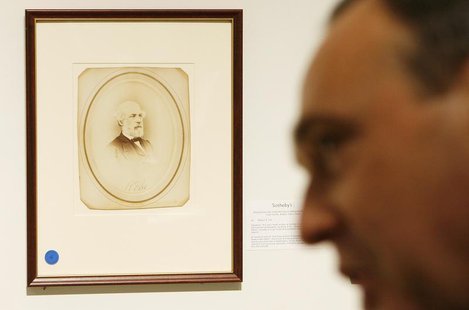 Selby Kiffer, American manuscript expert at Sotheby's, discusses historical documents in front of a signed portrait of Confederate General, Selby Kiffer, American manuscript expert at Sotheby's, discusses historical documents in front of a signed portrait of Confederate General,
