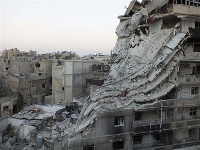 A general view shows buildings damaged by what activists said was shelling by forces loyal to Syria's President Bashar al-Assad in the Al-Kh A general view shows buildings damaged by what activists said was shelling by forces loyal to Syria's President Bashar al-Assad in the Al-Kh