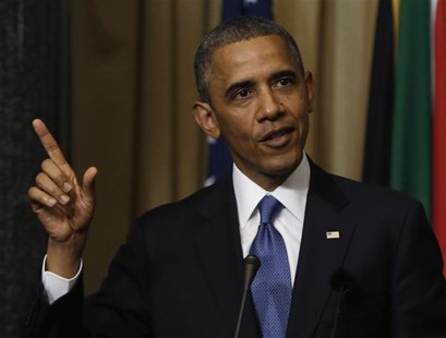 U.S. President Barack Obama answers a question at a joint news conference with South Africa's President Jacob Zuma (not pictured) at the Uni U.S. President Barack Obama answers a question at a joint news conference with South Africa's President Jacob Zuma (not pictured) at the Uni