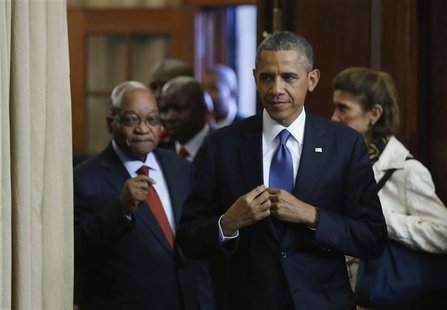 U.S. President Barack Obama (C) arrives at a joint news conference with South Africa's President Jacob Zuma (L) at the Union Buildings in Pr U.S. President Barack Obama (C) arrives at a joint news conference with South Africa's President Jacob Zuma (L) at the Union Buildings in Pr