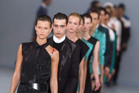 Models present creations during the HUGO Fashion Show by Hugo Boss at Berlin Fashion Week in Berlin, July 5, 2012. REUTERS/Thomas Peter Models present creations during the HUGO Fashion Show by Hugo Boss at Berlin Fashion Week in Berlin, July 5, 2012. REUTERS/Thomas Peter