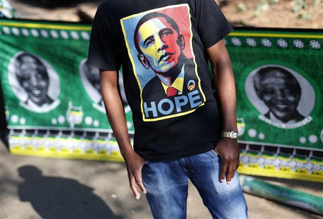A man wears a t-shirt with a portrait of U.S. President Barack Obama outside the Medi-Clinic Heart Hospital where former South African Presi A man wears a t-shirt with a portrait of U.S. President Barack Obama outside the Medi-Clinic Heart Hospital where former South African Presi