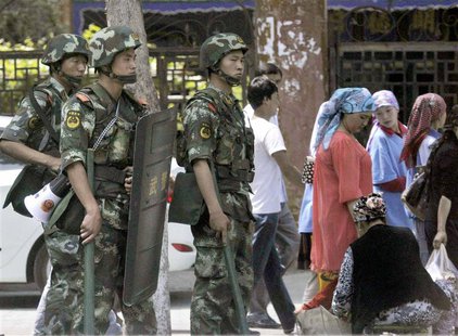Armed police officers stand guard near the international grand bazaar in Urumqi, Xinjiang Uighur Autonomous Region, in this photo taken by K Armed police officers stand guard near the international grand bazaar in Urumqi, Xinjiang Uighur Autonomous Region, in this photo taken by K