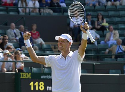 Tomas Berdych of the Czech Republic celebrates after defeating Kevin Anderson of South Africa in their men's singles tennis match at the Wim Tomas Berdych of the Czech Republic celebrates after defeating Kevin Anderson of South Africa in their men's singles tennis match at the Wim