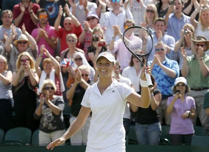 Laura Robson of Britain celebrates after defeating Marina Erakovic of New Zealand in their women's singles tennis match at the Wimbledon Ten Laura Robson of Britain celebrates after defeating Marina Erakovic of New Zealand in their women's singles tennis match at the Wimbledon Ten