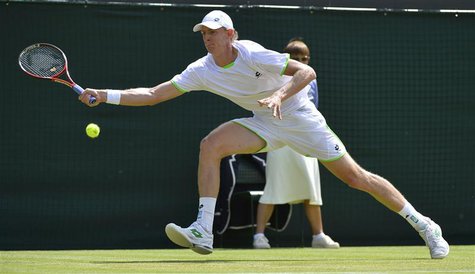 Kevin Anderson of South Africa hits a return to Tomas Berdych of the Czech Republic during their men's singles tennis match at the Wimbledon Kevin Anderson of South Africa hits a return to Tomas Berdych of the Czech Republic during their men's singles tennis match at the Wimbledon