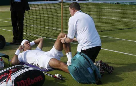 Juan Martin del Potro of Argentina receives attention after a fall in his men's singles tennis match against Grega Zemlja of Slovenia at the Juan Martin del Potro of Argentina receives attention after a fall in his men's singles tennis match against Grega Zemlja of Slovenia at the
