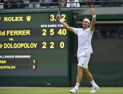 David Ferrer of Spain celebrates after defeating Alexandr Dolgopolov of Ukraine in their men's singles tennis match at the Wimbledon Tennis David Ferrer of Spain celebrates after defeating Alexandr Dolgopolov of Ukraine in their men's singles tennis match at the Wimbledon Tennis