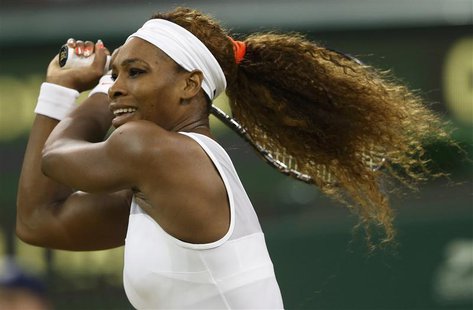 Serena Williams of the U.S. hits a return to Kimiko Date-Krumm of Japan in their women's singles tennis match at the Wimbledon Tennis Champi Serena Williams of the U.S. hits a return to Kimiko Date-Krumm of Japan in their women's singles tennis match at the Wimbledon Tennis Champi