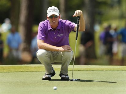Roberto Castro of the U.S. lines up his putt on the seventh hole during the first round of The Players Championship PGA golf tournament at T Roberto Castro of the U.S. lines up his putt on the seventh hole during the first round of The Players Championship PGA golf tournament at T