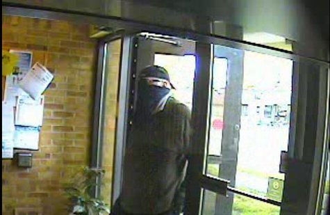 Security camera footage provided by the Calhoun County Sheriff's Office shows the suspect in the June 28, 2013 robbery of the Tekonsha branch of Southern Michigan Bank & Trust as he enters the bank. Security camera footage provided by the Calhoun County Sheriff's Office shows the suspect in the June 28, 2013 robbery of the Tekonsha branch of Southern Michigan Bank & Trust as he enters the bank.