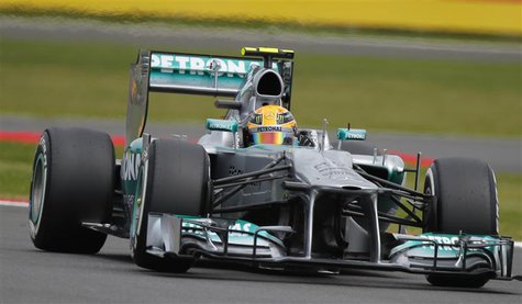 Mercedes Formula One driver Lewis Hamilton of Britain takes a curve during the qualifying session of the British Grand Prix at the Silversto Mercedes Formula One driver Lewis Hamilton of Britain takes a curve during the qualifying session of the British Grand Prix at the Silversto