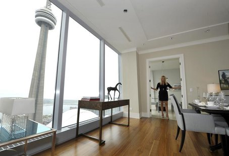 Sales Manager Jacqueline Yaffe poses in the dining room of the Ritz Carlton residents model suite in Toronto May 1, 2012. REUTERS/ Mike Cass Sales Manager Jacqueline Yaffe poses in the dining room of the Ritz Carlton residents model suite in Toronto May 1, 2012. REUTERS/ Mike Cass