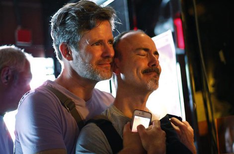 Patrons watch coverage of the U.S. Supreme Court ruling on the Defense of Marriage Act at the Stonewall Inn in New York June 26, 2013. REUTE Patrons watch coverage of the U.S. Supreme Court ruling on the Defense of Marriage Act at the Stonewall Inn in New York June 26, 2013. REUTE