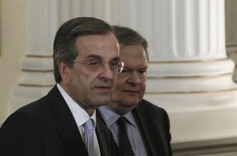 Greece's Prime Minister Antonis Samaras (L) and newly appointed Foreign Minister and Deputy Prime Minister Evangelos Venizelos walk after a Greece's Prime Minister Antonis Samaras (L) and newly appointed Foreign Minister and Deputy Prime Minister Evangelos Venizelos walk after a