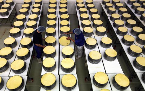 Employees work at a dairy plant in Litovel, one of the world's biggest producer of traditionally made parmesan cheese, June 27, 2012. REUTER Employees work at a dairy plant in Litovel, one of the world's biggest producer of traditionally made parmesan cheese, June 27, 2012. REUTER