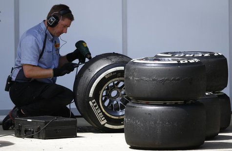 A Pirelli technician works on a tyre during the British Grand Prix at the Silverstone Race circuit, central England, June 30, 2013. REUTERS/ A Pirelli technician works on a tyre during the British Grand Prix at the Silverstone Race circuit, central England, June 30, 2013. REUTERS/