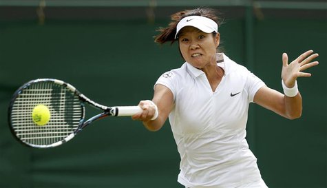 Li Na of China hits a return to Roberta Vinci of Italy during their women's singles tennis match at the Wimbledon Tennis Championships, in L Li Na of China hits a return to Roberta Vinci of Italy during their women's singles tennis match at the Wimbledon Tennis Championships, in L