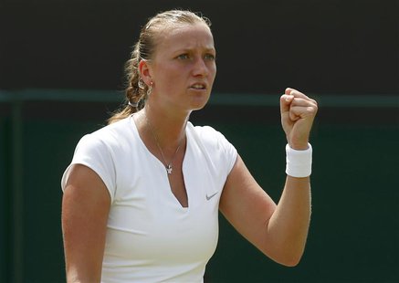 Petra Kvitova of the Czech Republic reacts after winning the first set during her women's singles tennis match against Carla Suarez Navarro Petra Kvitova of the Czech Republic reacts after winning the first set during her women's singles tennis match against Carla Suarez Navarro