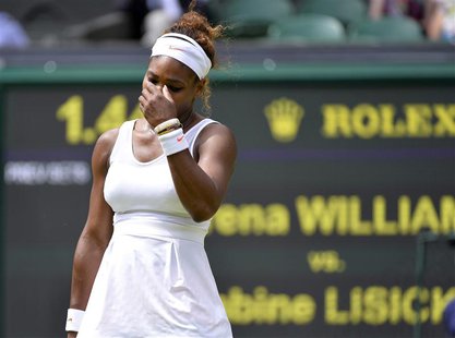 Serena Williams of the U.S. reacts during her women's singles tennis match against Sabine Lisicki of Germany at the Wimbledon Tennis Champio Serena Williams of the U.S. reacts during her women's singles tennis match against Sabine Lisicki of Germany at the Wimbledon Tennis Champio