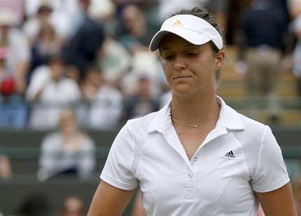 Laura Robson of Britain reacts after being defeated by Kaia Kanepi of Estonia in their women's singles tennis match at the Wimbledon Tennis Laura Robson of Britain reacts after being defeated by Kaia Kanepi of Estonia in their women's singles tennis match at the Wimbledon Tennis