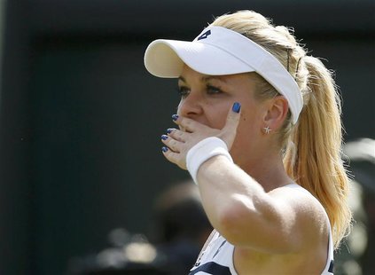 Agnieszka Radwanska of Poland celebrates after defeating Tsvetana Pironkova of Bulgaria in their women's singles tennis match at the Wimbled Agnieszka Radwanska of Poland celebrates after defeating Tsvetana Pironkova of Bulgaria in their women's singles tennis match at the Wimbled