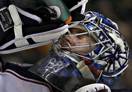 Columbus Blue Jackets goalie Sergei Bobrovsky squirts water on his face during a break in the play of their NHL hockey game against the Vanc Columbus Blue Jackets goalie Sergei Bobrovsky squirts water on his face during a break in the play of their NHL hockey game against the Vanc